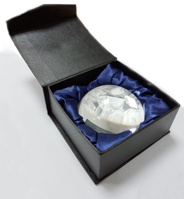 Why not opt for a classy crystal paperweight